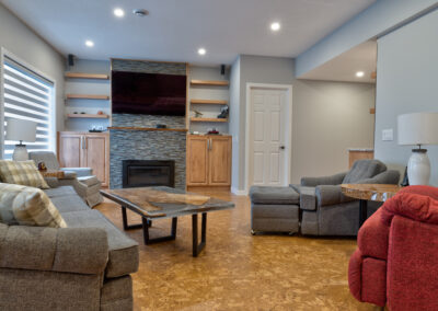 basement renovation with stone fireplace | Versatile Renovations